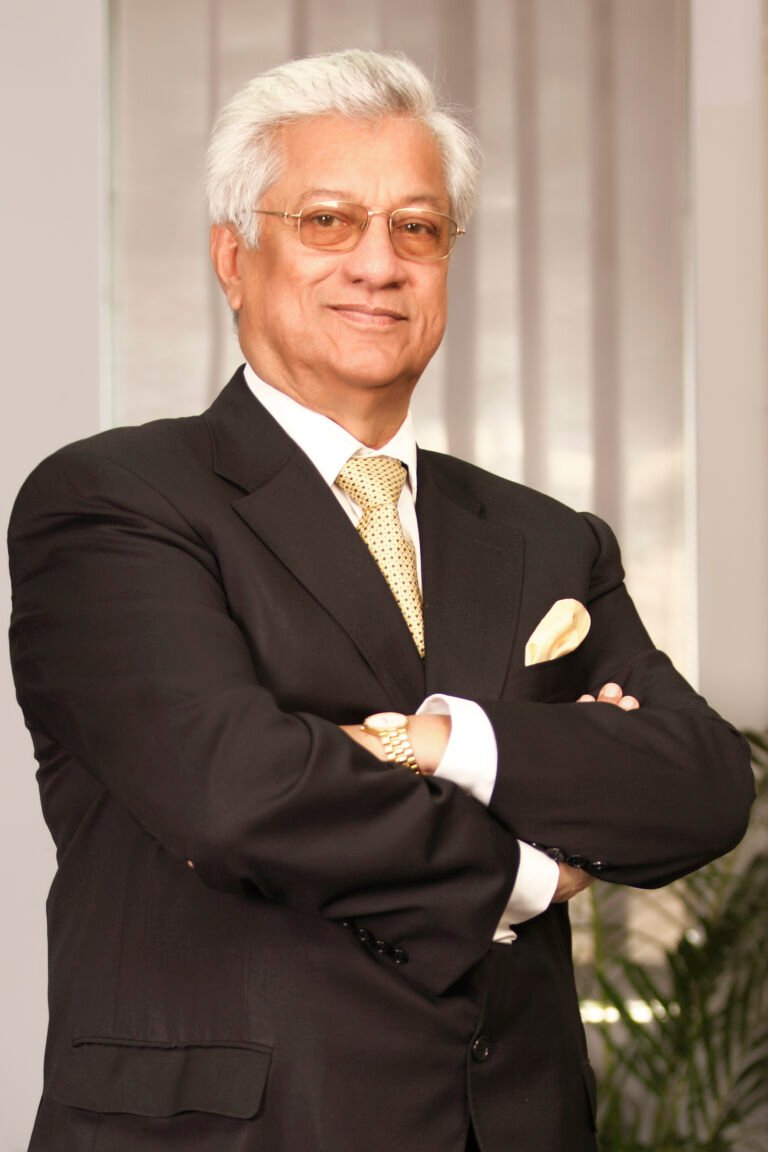 Professional headshot of a corporate executive in a dark suit, photographed in Dhaka by Abu Naser